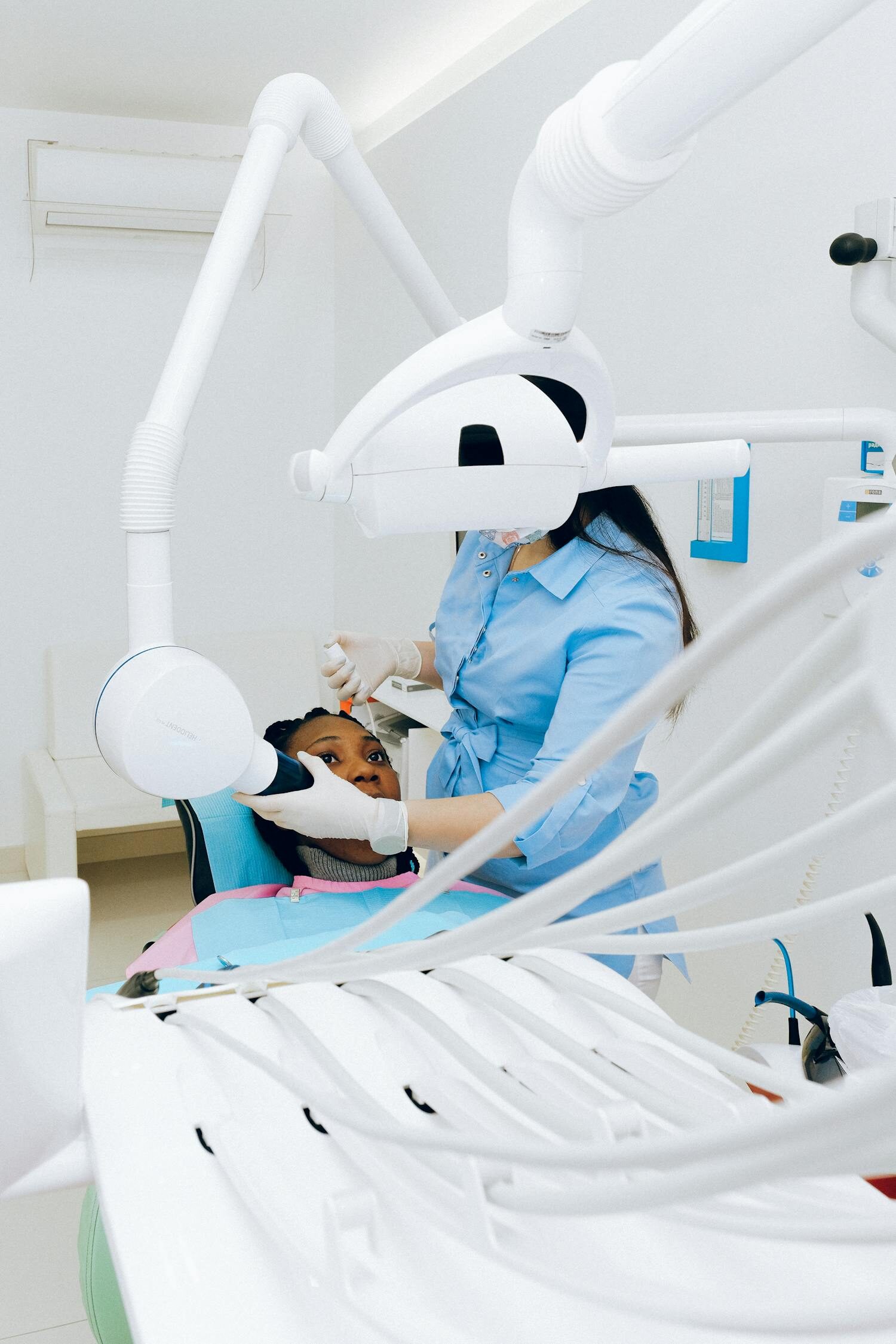 A dentist carrying out a gentle check-up with a patient